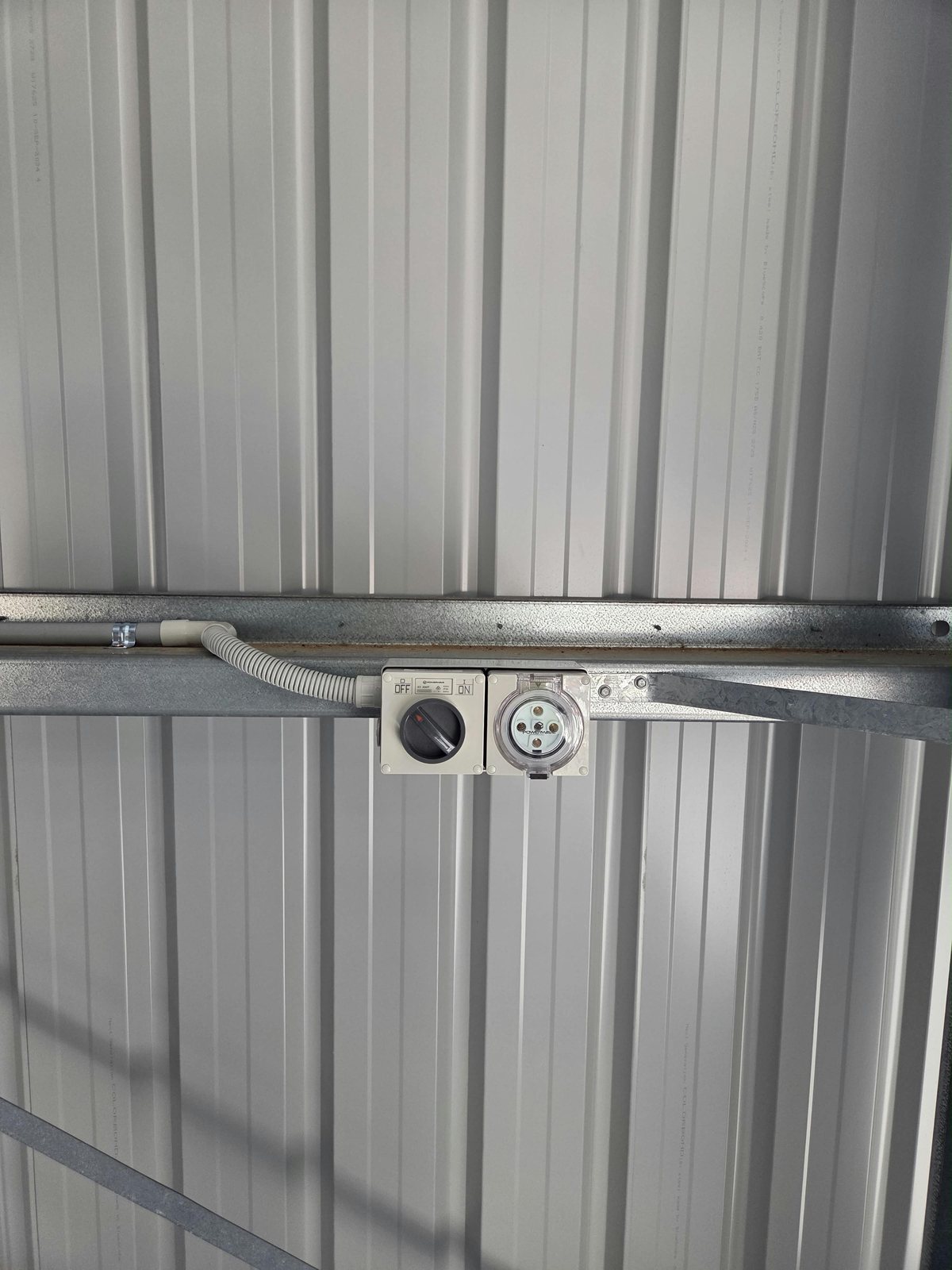 Three-phase outlet and 40-amp isolator mounted in a shed by MVS Connect